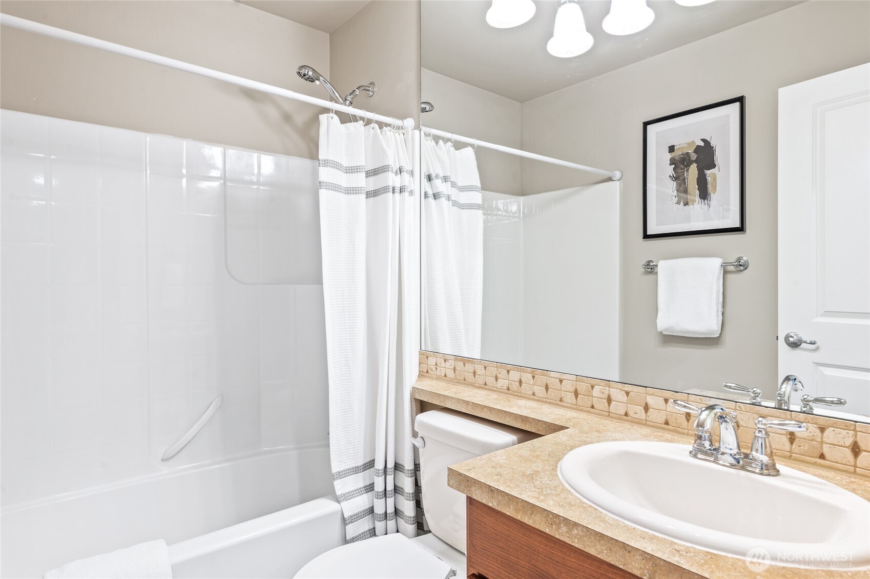 5205 Northeast 10th Street Renton, WA 98059 - Photo 20 of 28 a bathroom with a sink toilet and shower
