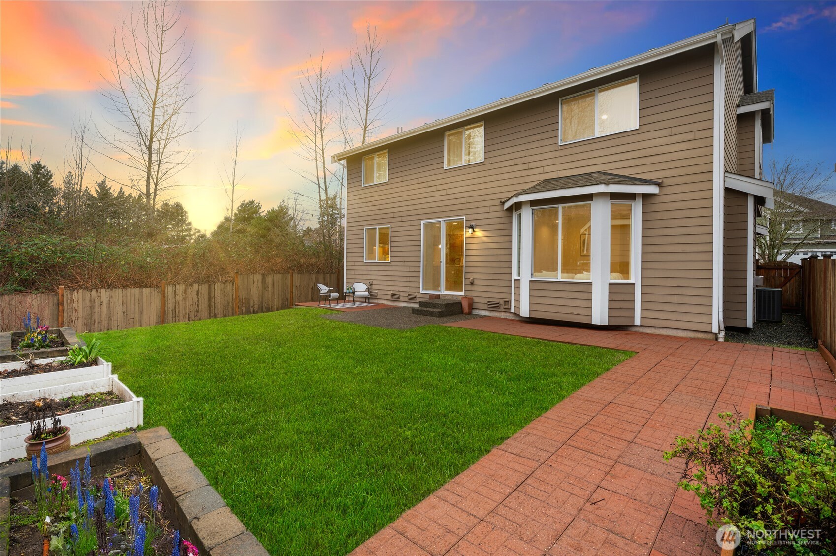 5205 Northeast 10th Street Renton, WA 98059 - Photo 26 of 28 a front view of a house with garden
