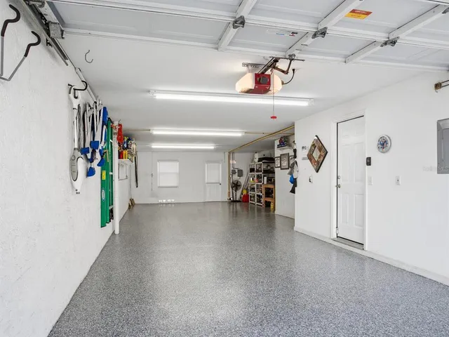 a kitchen with stainless steel appliances granite countertop a refrigerator stove microwave and sink