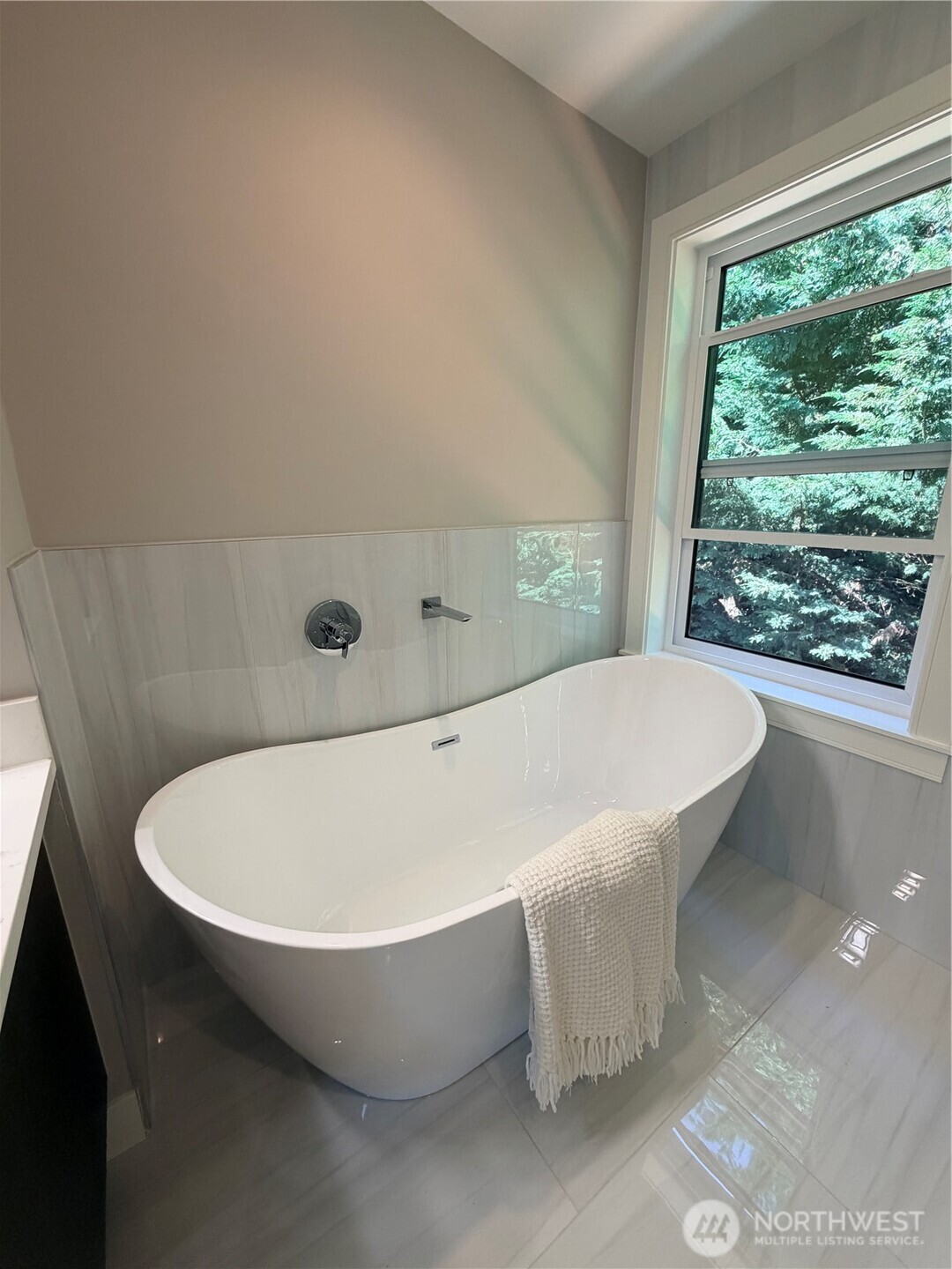4305 Northeast 26th Court Renton, WA 98059 - Photo 31 of 40 a bath tub sitting in a bathroom next to a window
