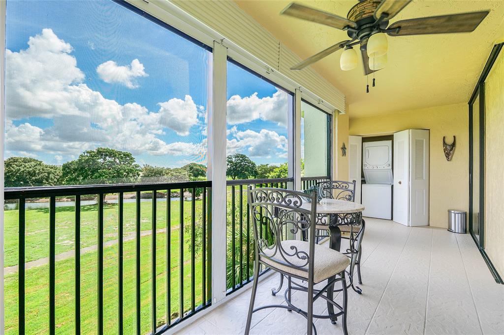 a view of a balcony with furniture