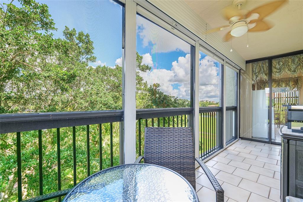 3650 Environ Boulevard, Unit 401 Lauderhill, FL 33319 - Photo 19 of 59 a view of a porch with wooden floor and outdoor space