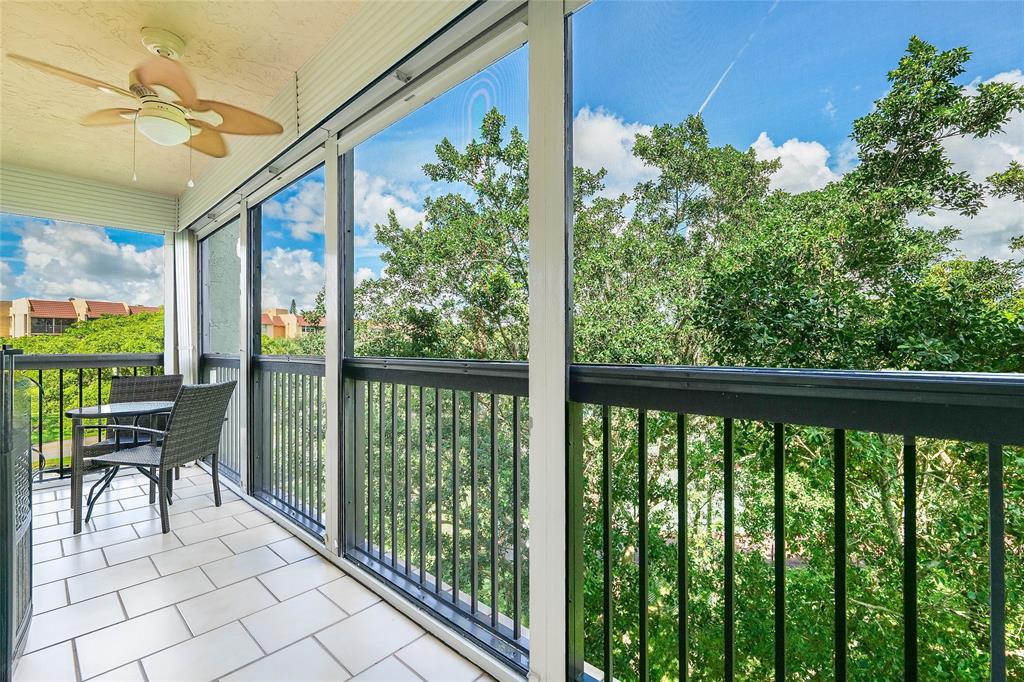 3650 Environ Boulevard, Unit 401 Lauderhill, FL 33319 - Photo 20 of 59 a view of a chairs and table in the balcony