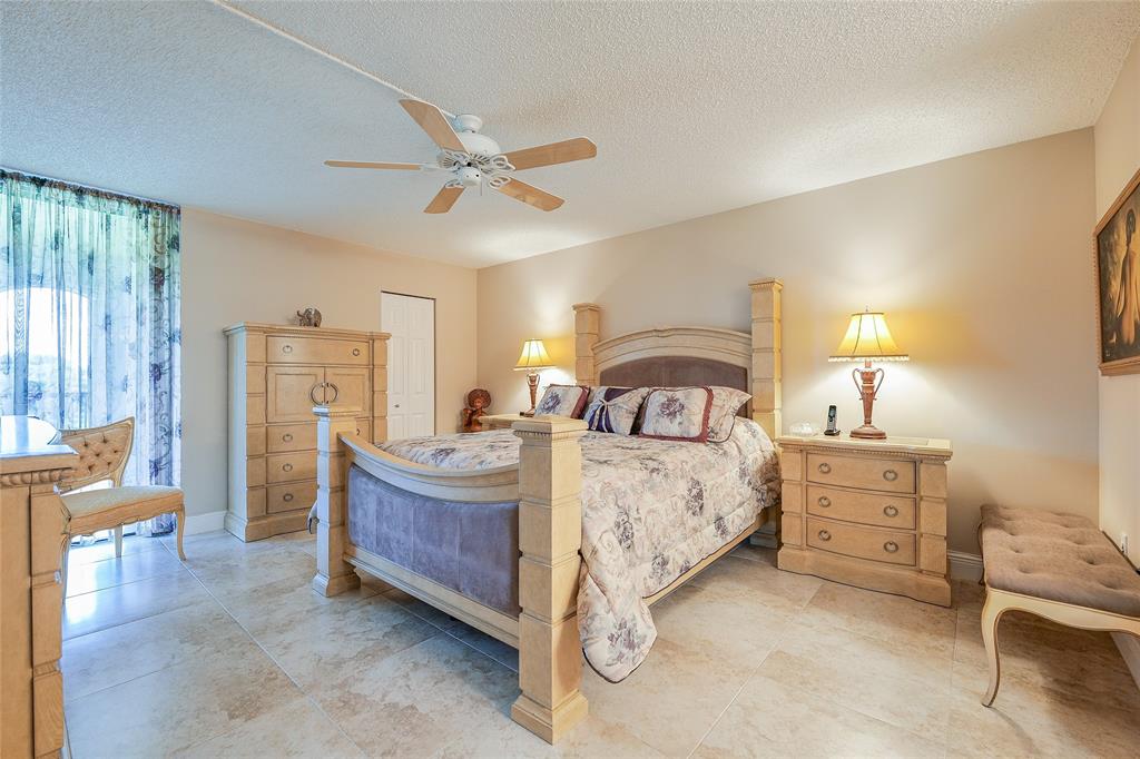 3650 Environ Boulevard, Unit 401 Lauderhill, FL 33319 - Photo 21 of 59 a bedroom with a bed and furniture