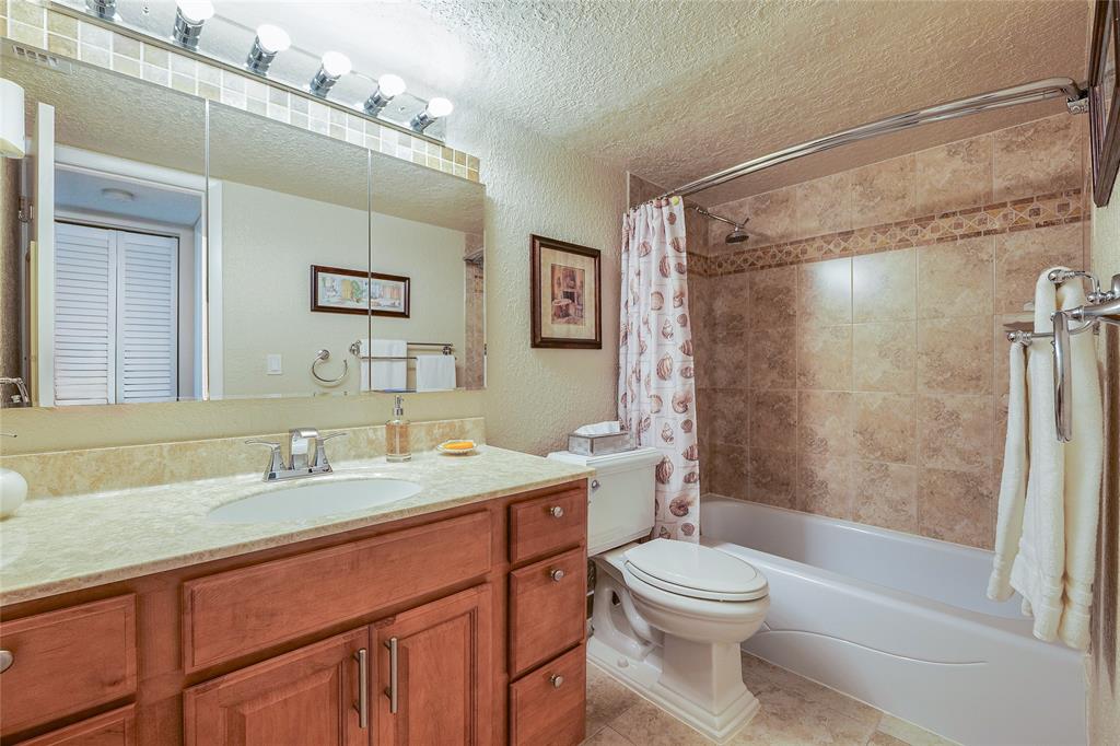 3650 Environ Boulevard, Unit 401 Lauderhill, FL 33319 - Photo 31 of 59 a bathroom with a sink a toilet and shower