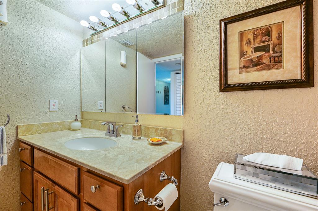 3650 Environ Boulevard, Unit 401 Lauderhill, FL 33319 - Photo 32 of 59 a bathroom with a sink and a mirror