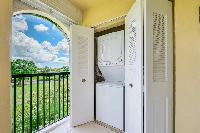 a view of a livingroom with furniture and staircase