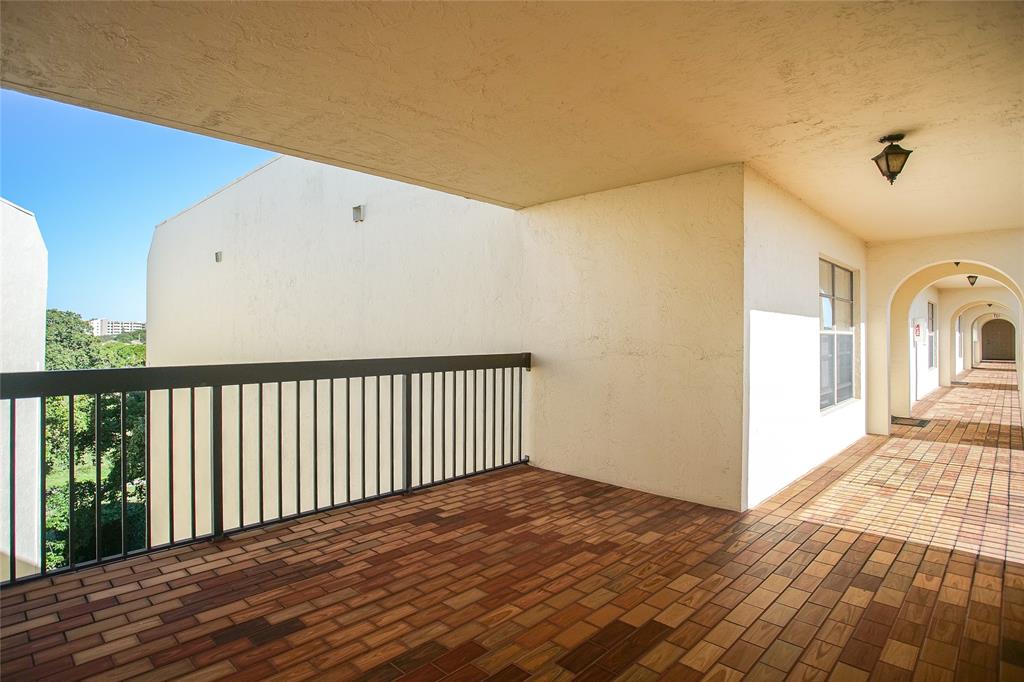 3650 Environ Boulevard, Unit 401 Lauderhill, FL 33319 - Photo 37 of 59 a view of a hallway with wooden floor