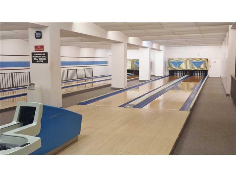 3650 Environ Boulevard, Unit 401 Lauderhill, FL 33319 - Photo 54 of 59 a kitchen with stainless steel appliances kitchen island granite countertop a sink and cabinets