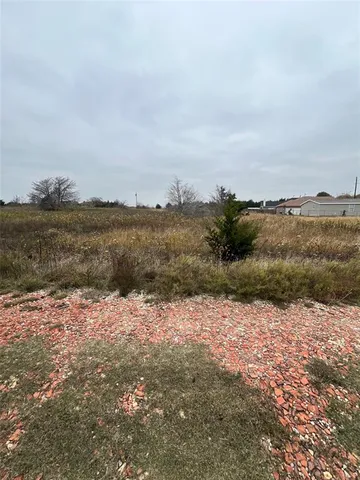 a view of a lake with houses in the back