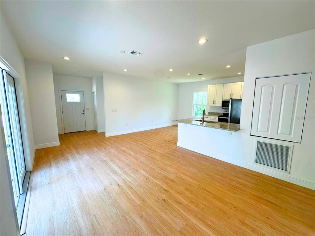 8297 Strasse Boulevard Punta Gorda, FL 33982 - Photo 12 of 31 a view of a kitchen with a sink and a refrigerator