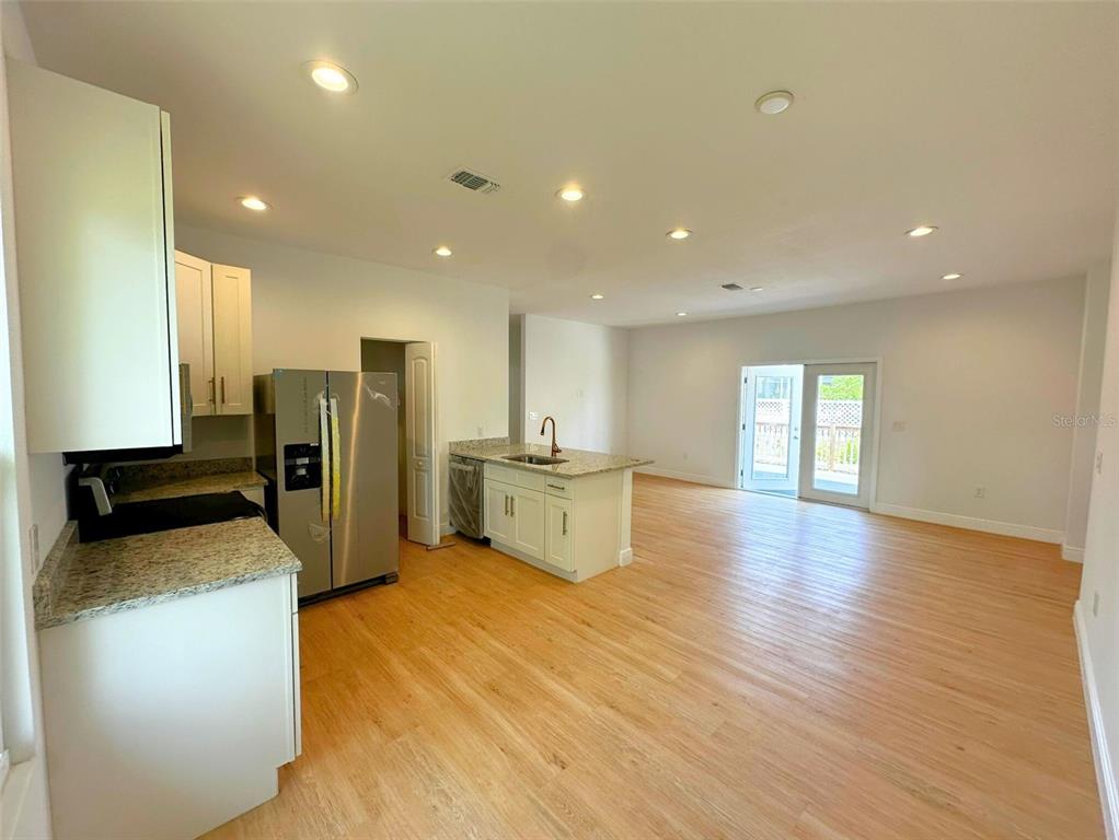 8297 Strasse Boulevard Punta Gorda, FL 33982 - Photo 17 of 31 a view of a kitchen with a sink and a refrigerator