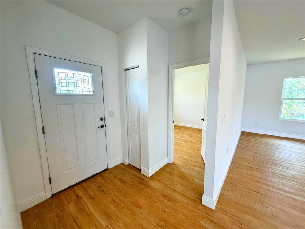 8297 Strasse Boulevard Punta Gorda, FL 33982 - Photo 18 of 31 a view of a hallway with wooden floor and closet