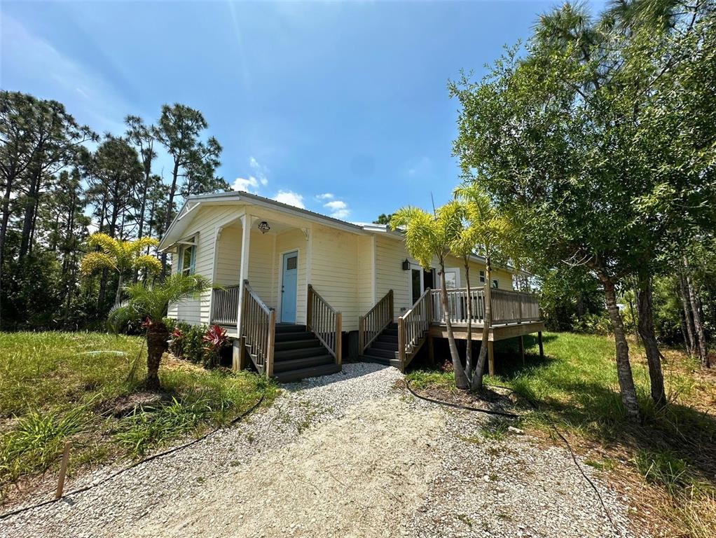 8297 Strasse Boulevard Punta Gorda, FL 33982 - Photo 2 of 31 a house view with a backyard space