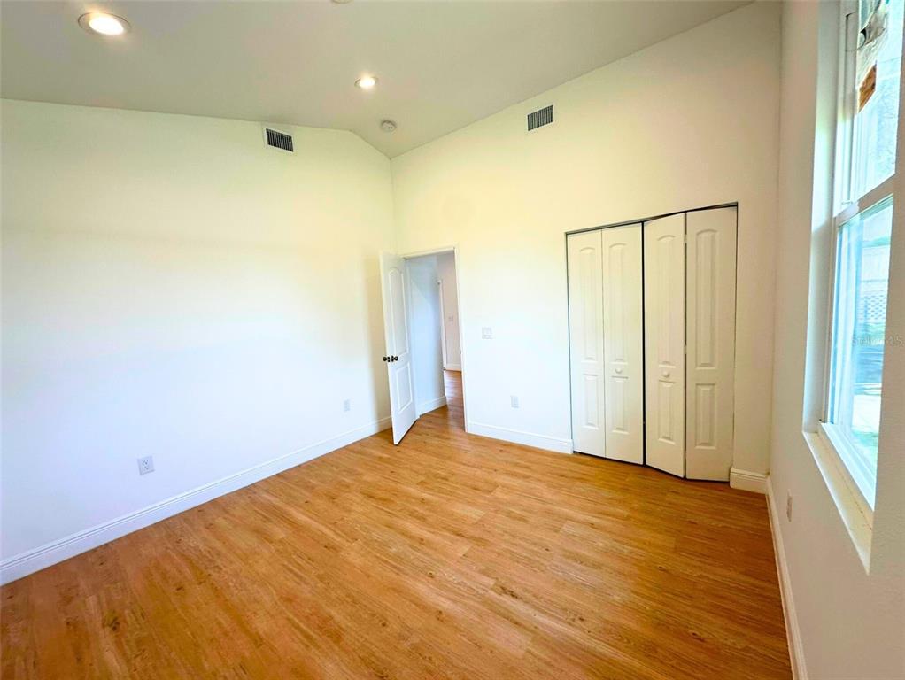 8297 Strasse Boulevard Punta Gorda, FL 33982 - Photo 26 of 31 a view of empty room with wooden floor and fan