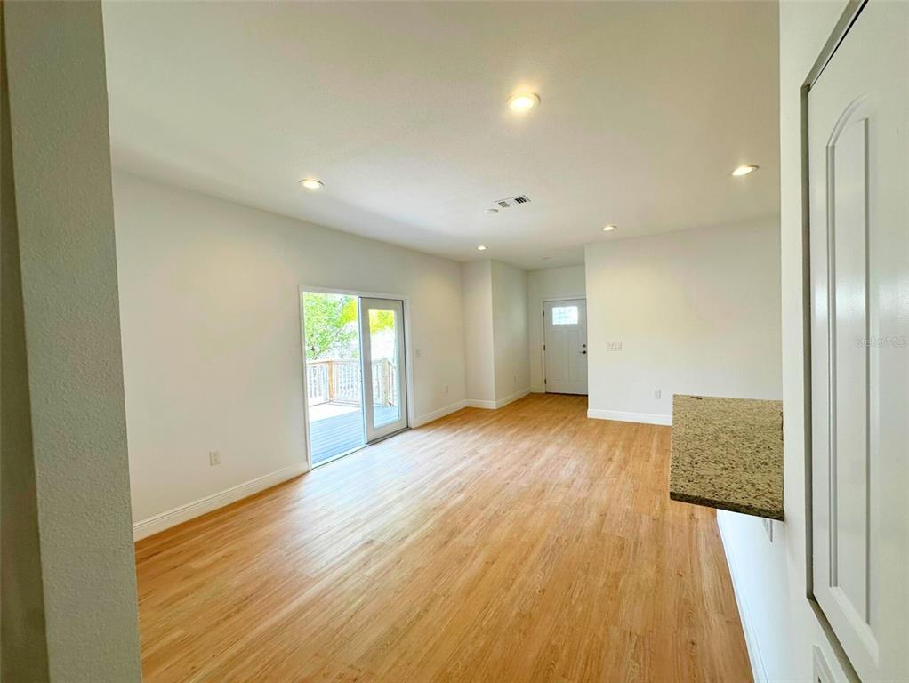 8297 Strasse Boulevard Punta Gorda, FL 33982 - Photo 28 of 31 a view of an empty room with wooden floor and a window