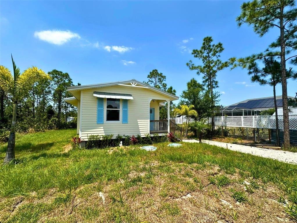 8297 Strasse Boulevard Punta Gorda, FL 33982 - Photo 3 of 31 a view of a house with a yard