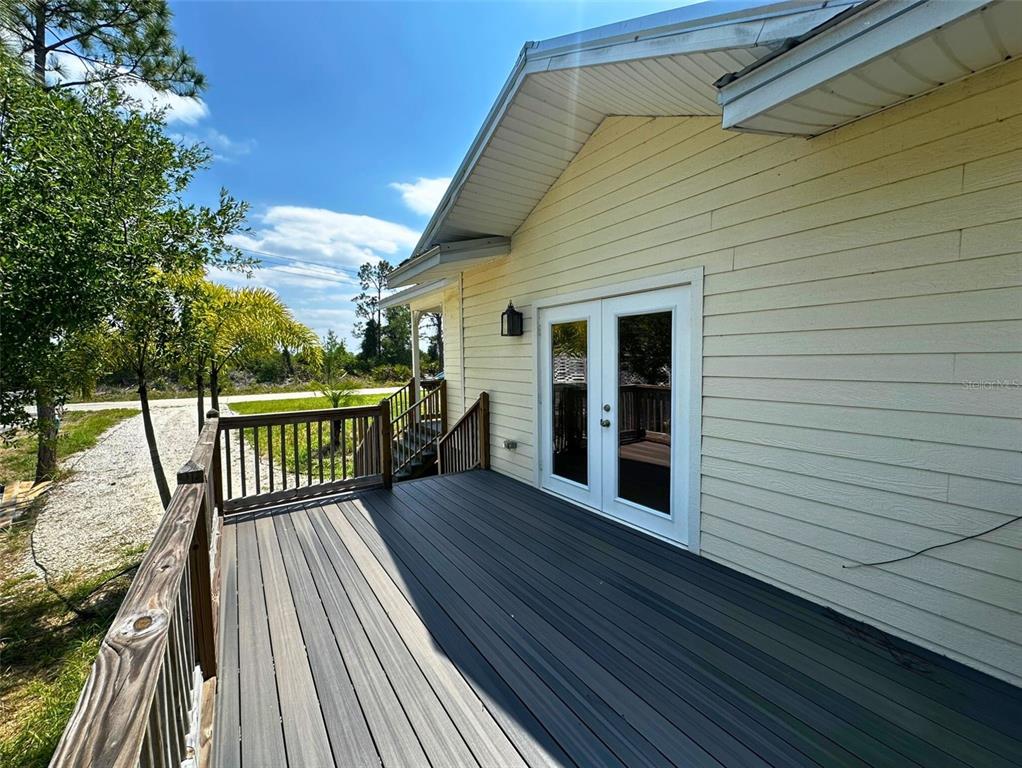 8297 Strasse Boulevard Punta Gorda, FL 33982 - Photo 4 of 31 a view of a wooden deck with a yard