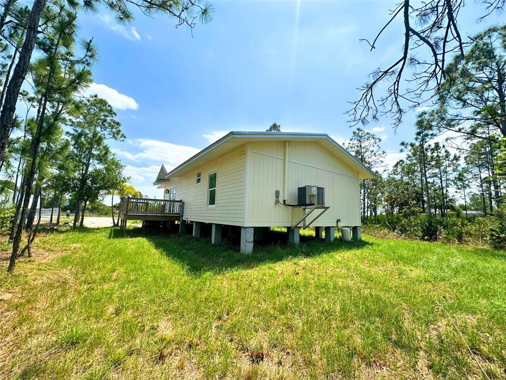 8297 Strasse Boulevard Punta Gorda, FL 33982 - Photo 7 of 31 a house view with swimming pool and garden space