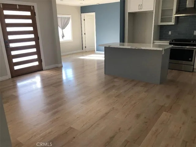 a kitchen with stainless steel appliances a stove and a refrigerator