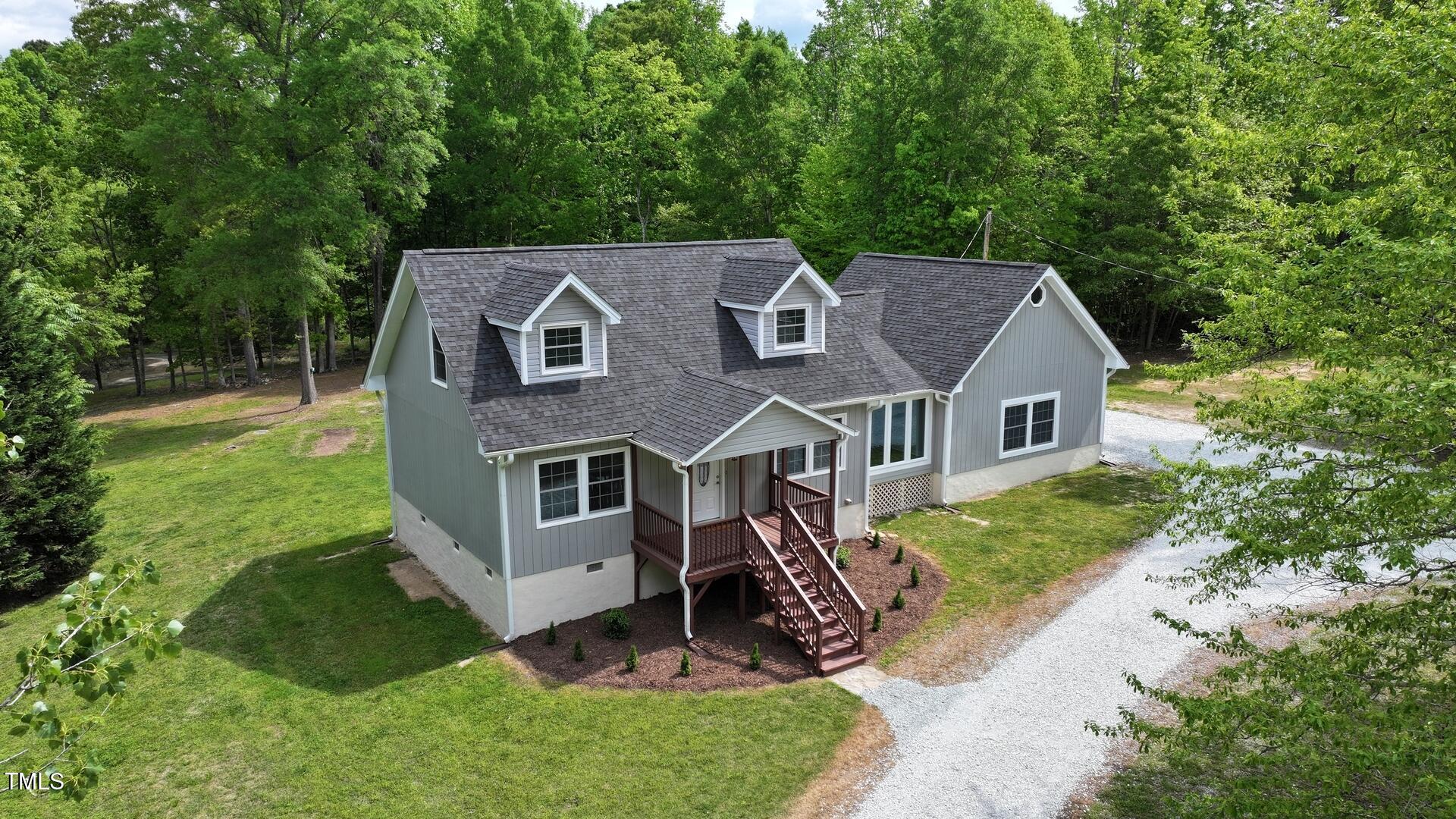 35 Fire Tower Drive Rougemont, NC 27572 - Photo 7 of 72 a aerial view of a house next to a big yard and large trees