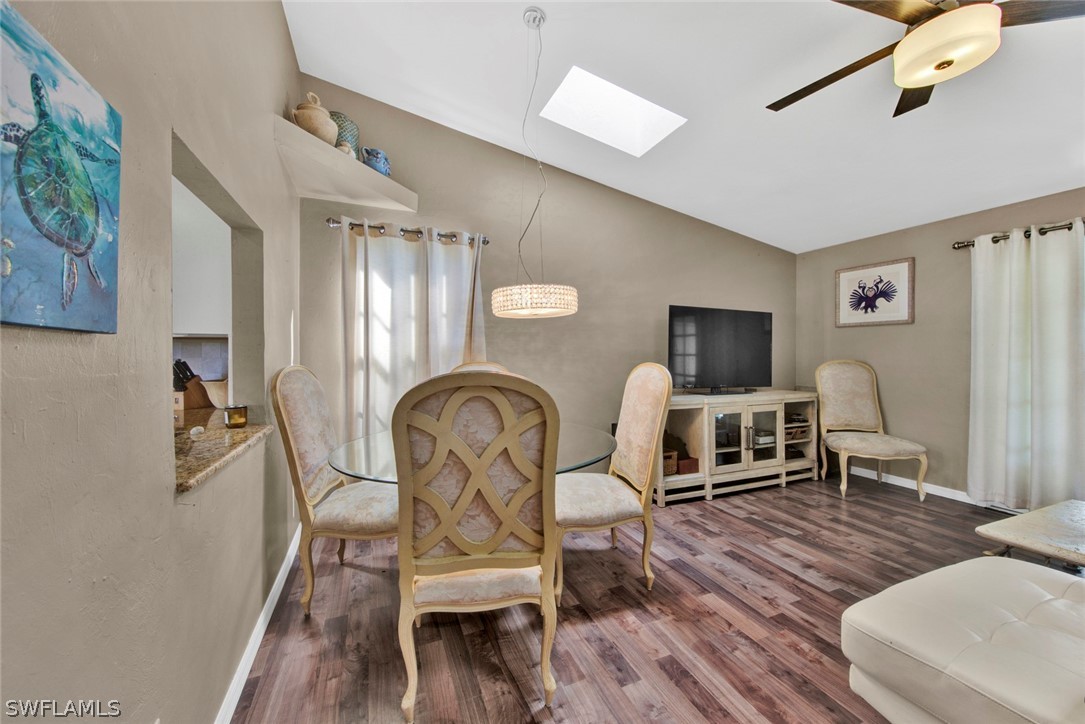 18442 Sunflower Road Fort Myers, FL 33967 - Photo 14 of 26 a living room with furniture a rug and wooden floor