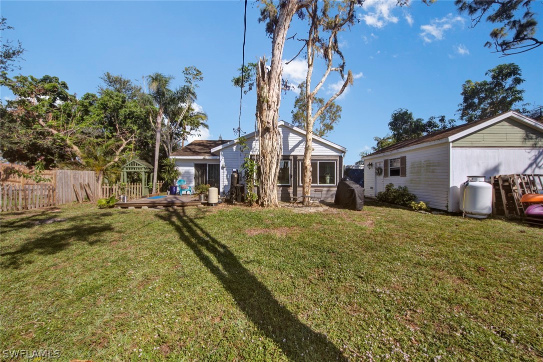 18442 Sunflower Road Fort Myers, FL 33967 - Photo 25 of 26 a front view of a house with a yard