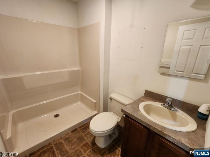 128 Big Piece Road Fairfield, NJ 07004 - Photo 16 of 26 a bathroom with a sink toilet and shower