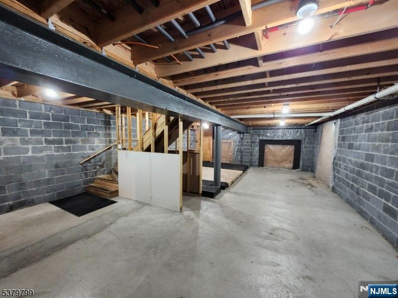 128 Big Piece Road Fairfield, NJ 07004 - Photo 17 of 26 a view of an empty room with a staircase