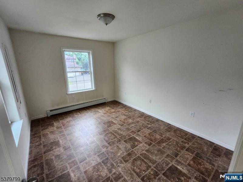 128 Big Piece Road Fairfield, NJ 07004 - Photo 7 of 26 an empty room with a window