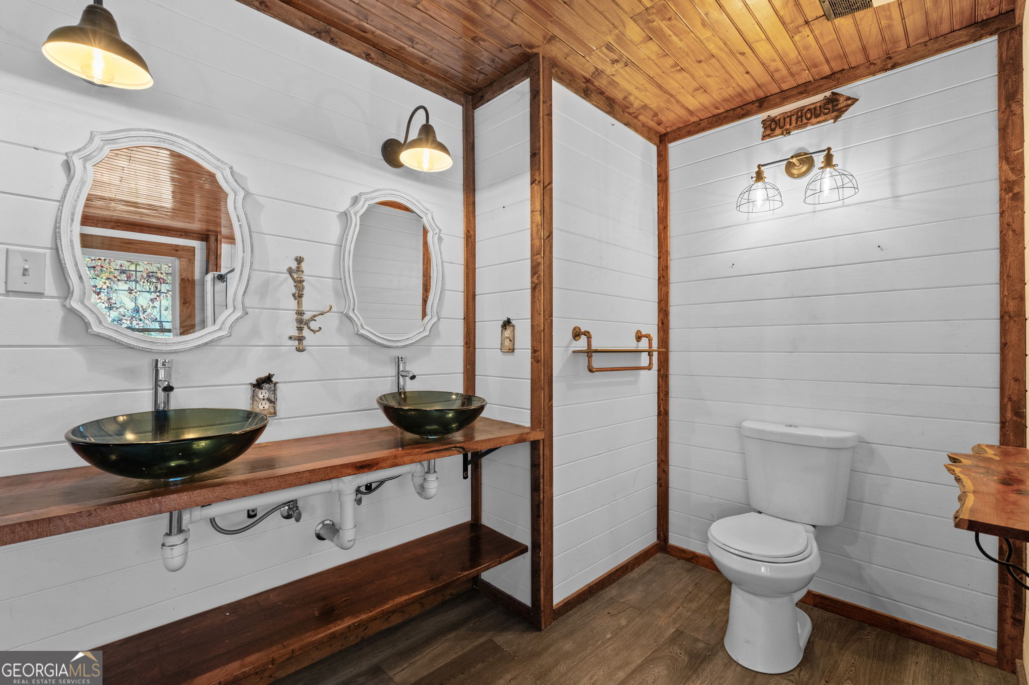 49 Frost Road Bowdon, GA 30108 - Photo 23 of 60 a bathroom with a toilet a sink and mirror