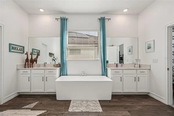a living room with furniture a ceiling fan and a window