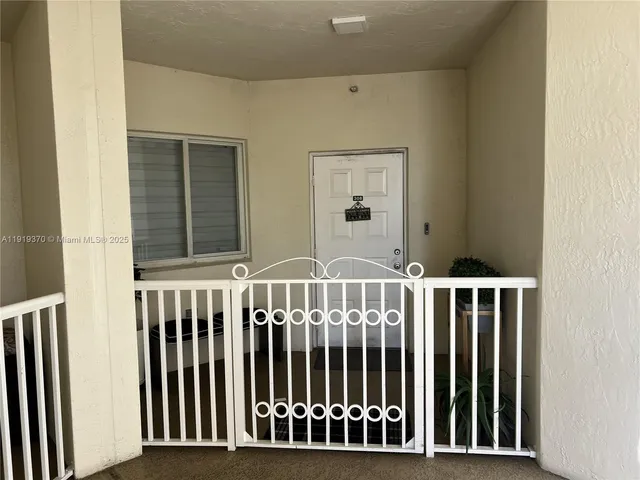a view of a porch with wooden floor