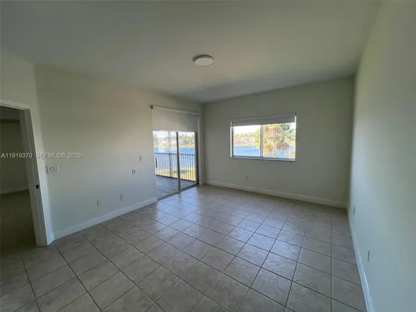 a view of an empty room and window