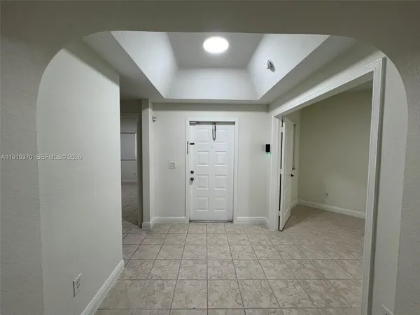 a spacious bathroom with a double vanity sink toilet and shower