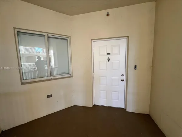 a view of a porch with wooden floor