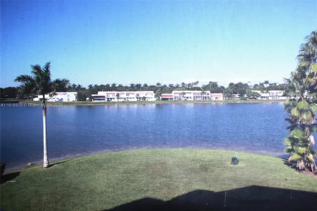 an aerial view of residential houses with outdoor space and seating