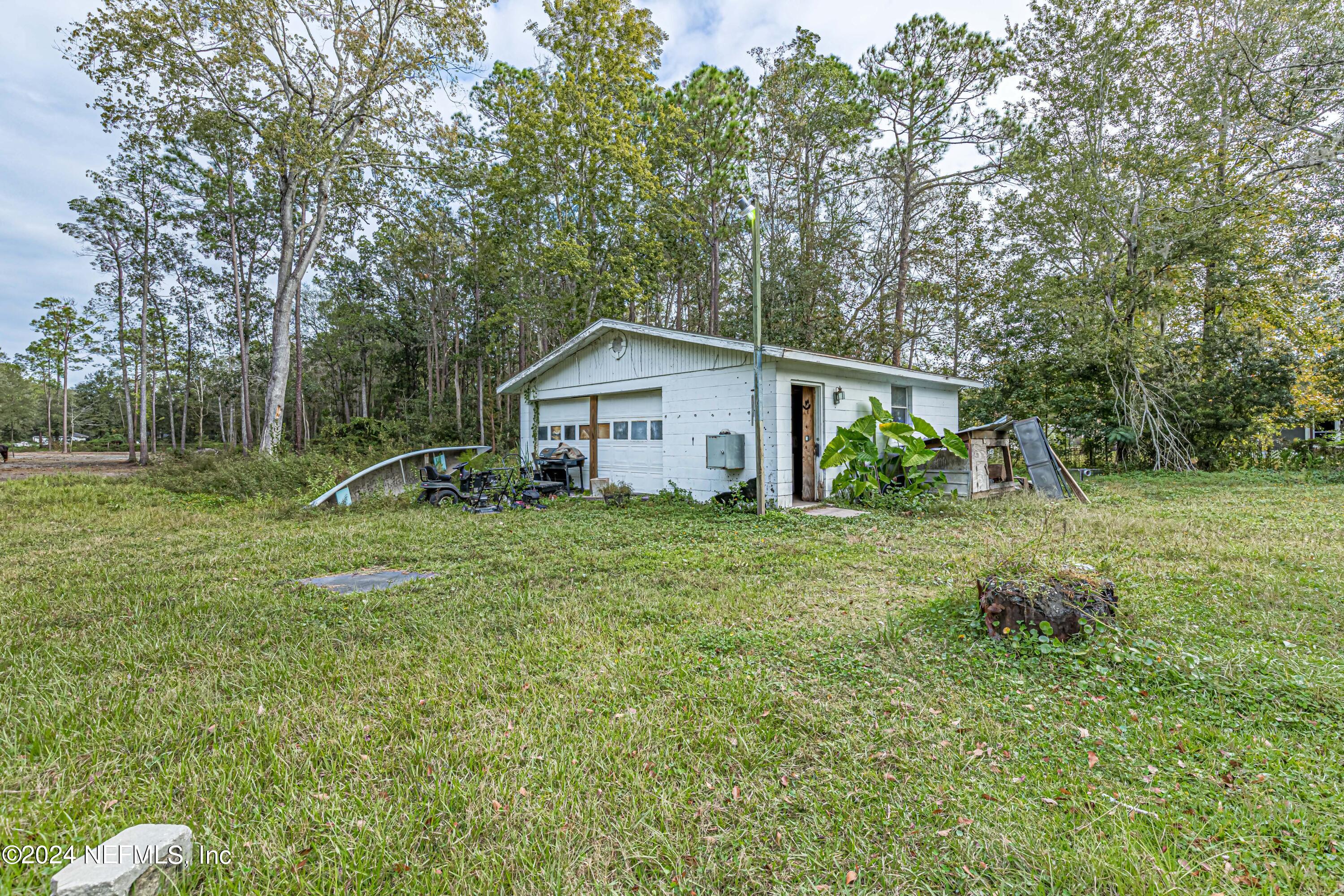4058 Pinto Road Middleburg, FL 32068 - Photo 5 of 6 a view of a house with backyard and a tree