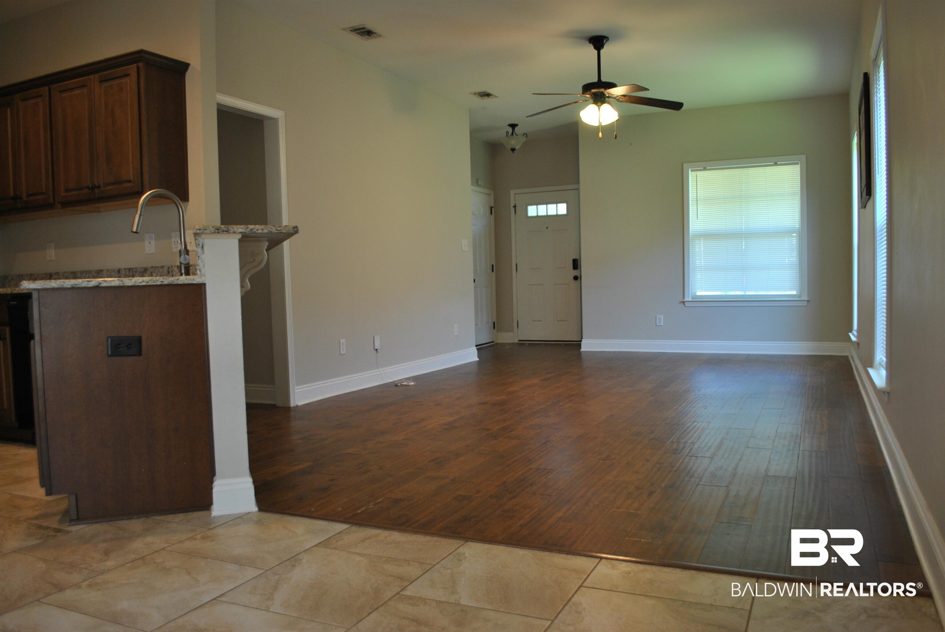 2161 Spring Grove West Mobile, AL 36695 - Photo 11 of 31 Unfurnished living room featuring ceiling fan and wood finished floors