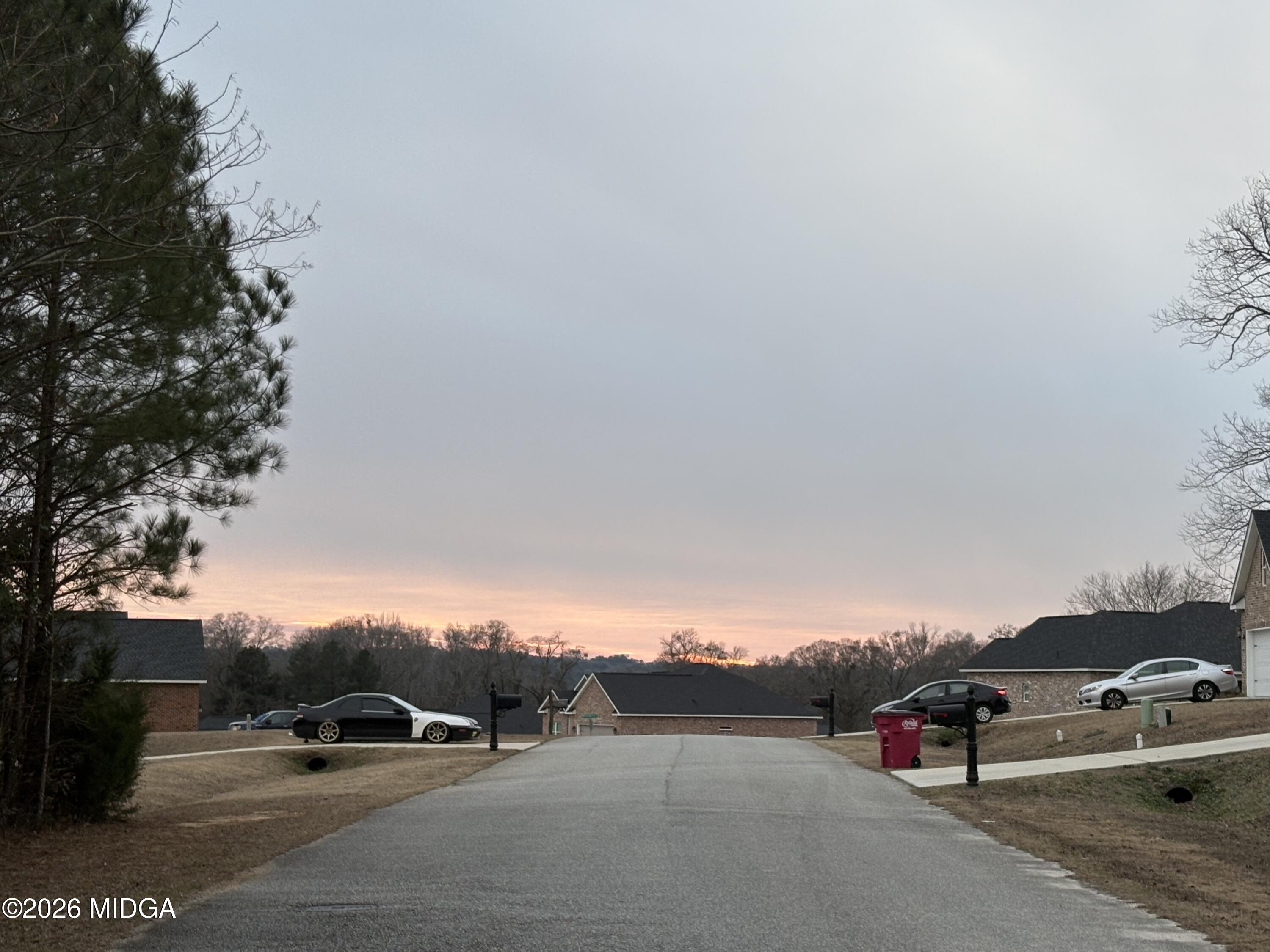 7136 Wimpy Road Macon, GA 31216 - Photo 6 of 6 a view of street with parked cars