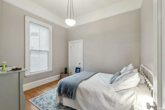 a kitchen with stainless steel appliances a stove a sink cabinets and a refrigerator