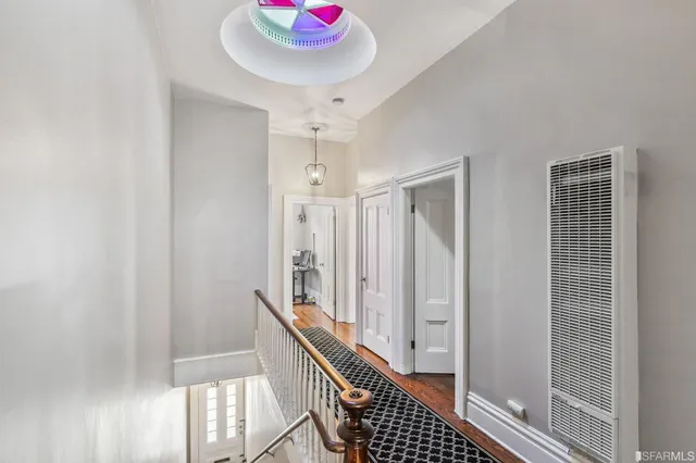 a kitchen with granite countertop stainless steel appliances and wooden cabinets