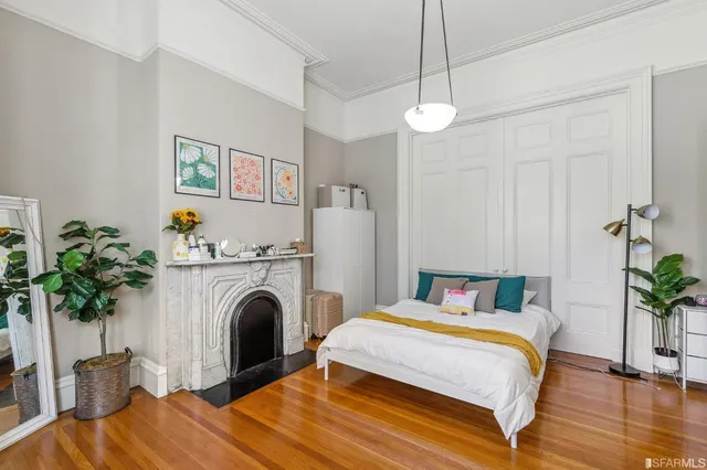 a bedroom with a bed and a couch