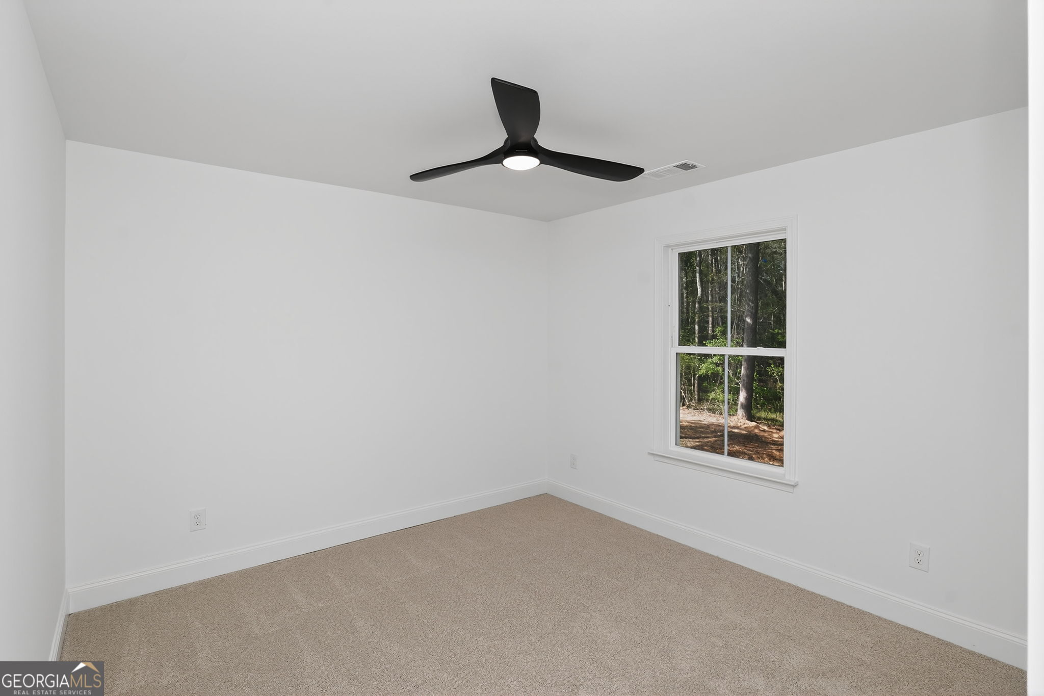 1229 Chappell Mill Road Jackson, GA 30233 - Photo 41 of 55 an empty room with a window