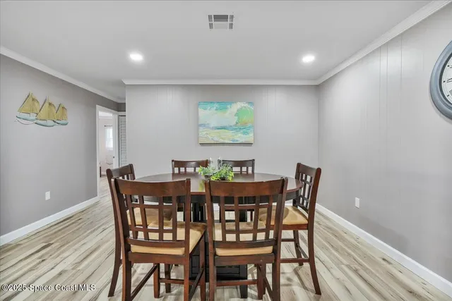 a bathroom with a granite countertop sink mirror vanity and toilet
