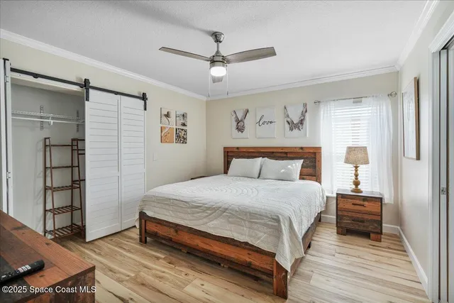 a kitchen with stainless steel appliances granite countertop a stove top oven a sink dishwasher a dining table and chairs with wooden floor