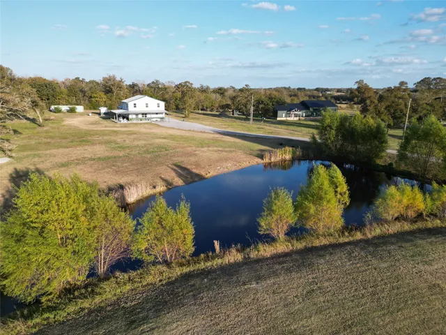 a front view of a house with a garden and porch