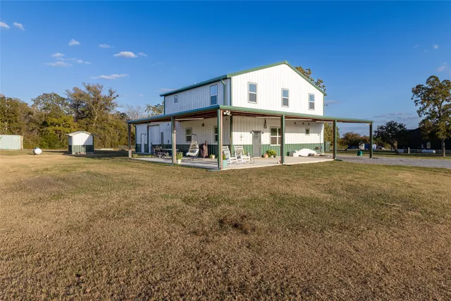 a view of a lake with houses in the back