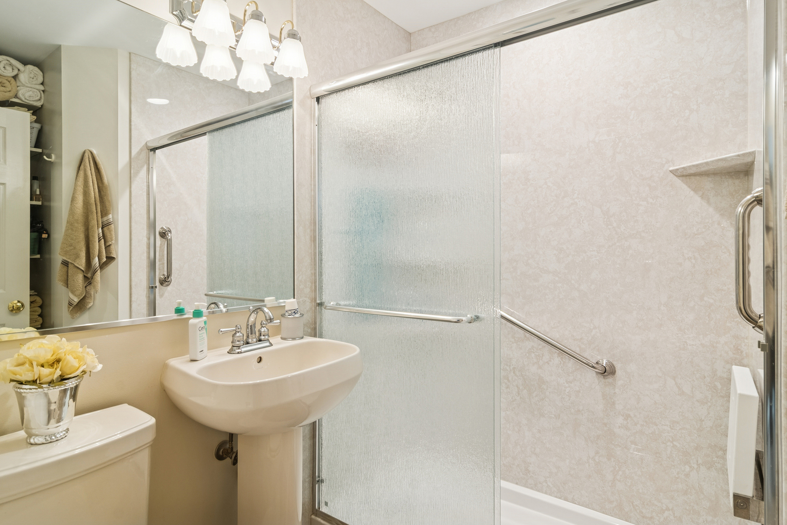 3407 Pheasant Drive Rolling Meadows, IL 60008 - Photo 11 of 16 a bathroom with a sink a mirror and a shower