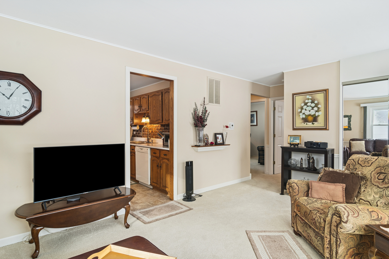 3407 Pheasant Drive Rolling Meadows, IL 60008 - Photo 2 of 16 a living room with furniture and a flat screen tv